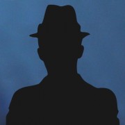 Silhouette of a man in a trilby hat